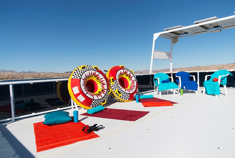 Top deck of a houseboat with tubs and towels