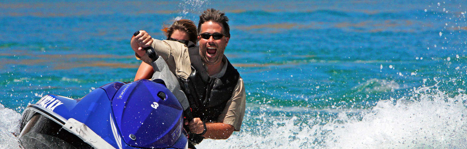 people on a jet ski in the water