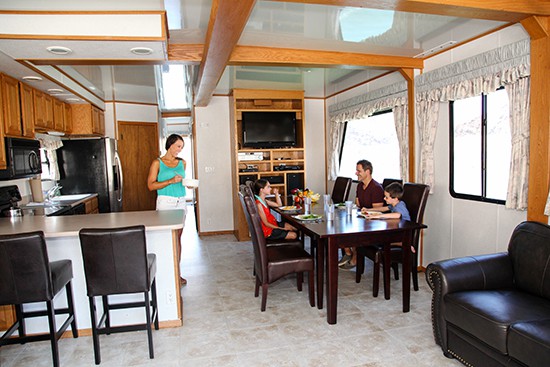 Family sitting at a table on a houseboat