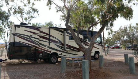 Recreation Vehicle (RV camper) parked in a parking spot