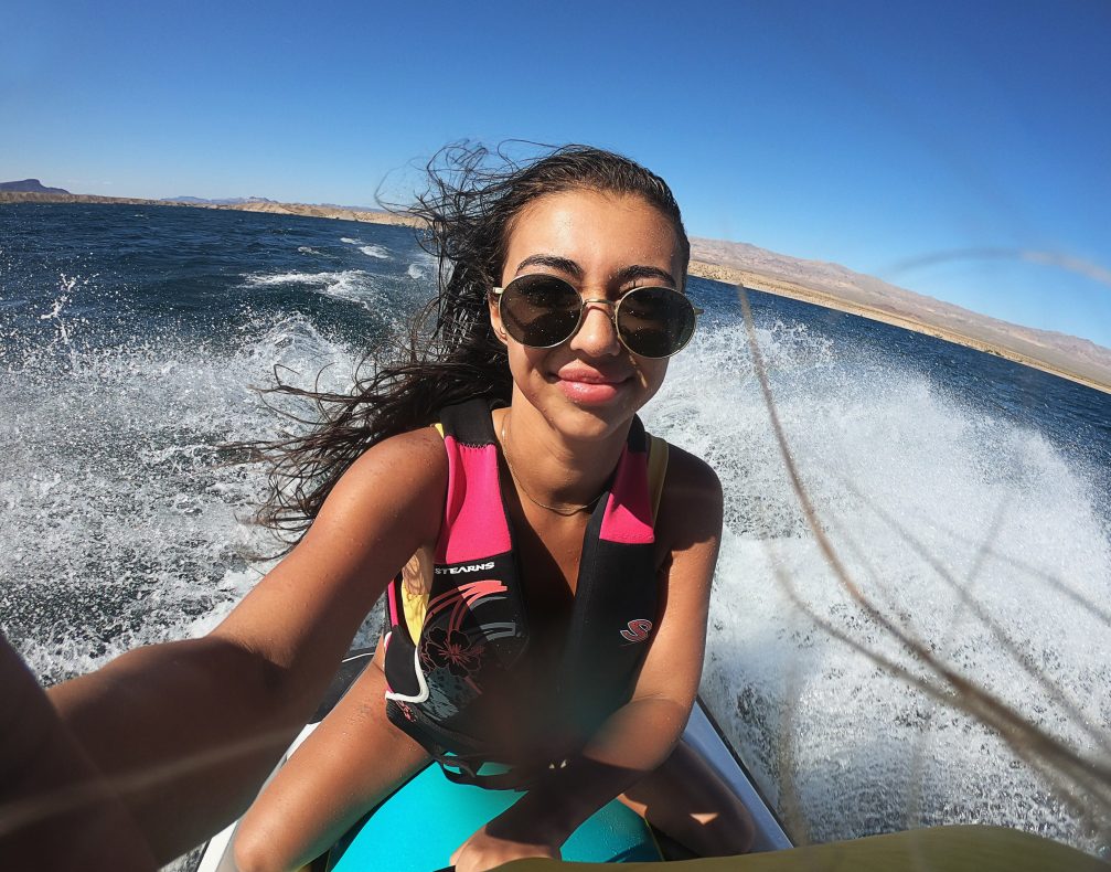 Young woman riding on a jet ski