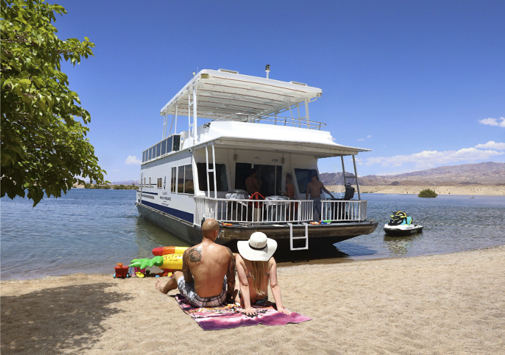 Houseboat on the beach under a clear blue sky on a sunny day
