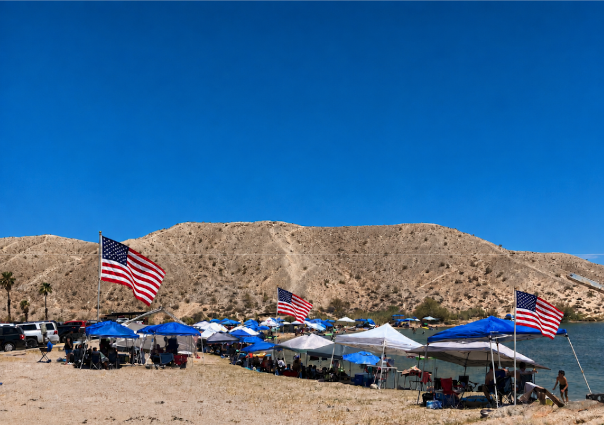 Fourth of July celebration with American flags and red white and blue decor on the bay by the water